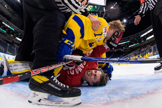 Åke Stakkestad of Sweden and Connor Bedard of Canada fight