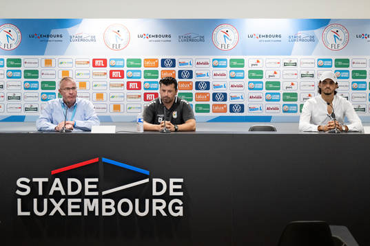A translator, head coach Carlos Fanguerio and Aldin