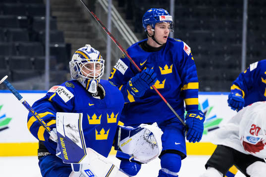Goaltender Jesper Wallstedt and Helge Grans of Sweden