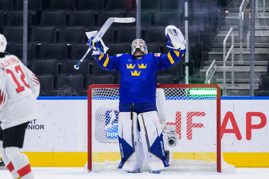 goaltender Jesper Wallstedt of Sweden celebrates
