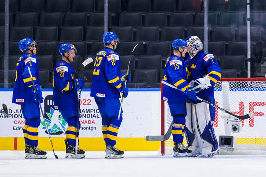 Åke Stakkestad and goaltender Jesper Wallstedt of Sweden