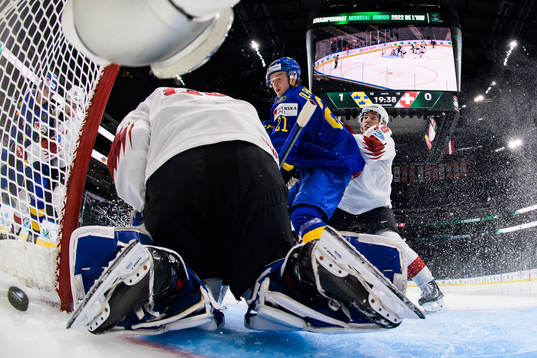 Oskar Olausson of Sweden (R) sees Daniel Torgersson of