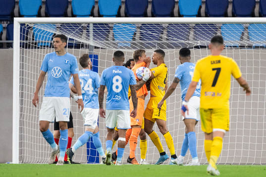 Goalkeeper Johan Dahlin of Malmö and Magno De Souza