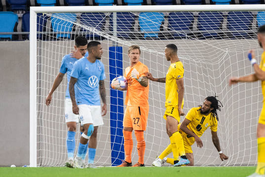Goalkeeper Johan Dahlin of Malmö and Magno De Souza