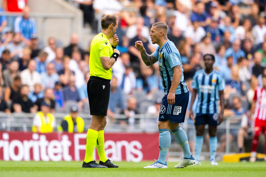 Referee Sascha Stegemann and Victor Edvardsen of Djurgården