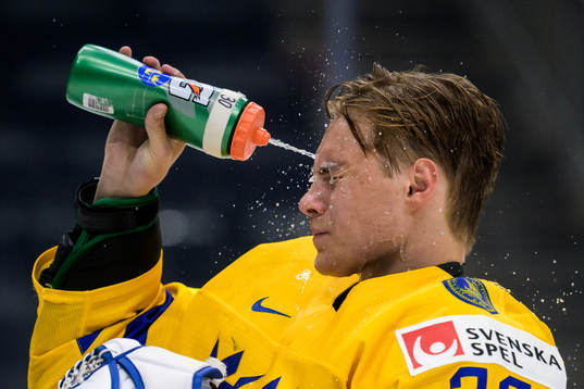 Goaltender Calle Clang of Sweden sprays water