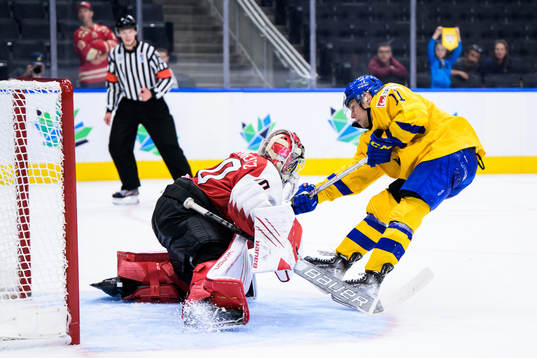 Goaltender Sebastian Wraneschitz of Austria saves a penalty