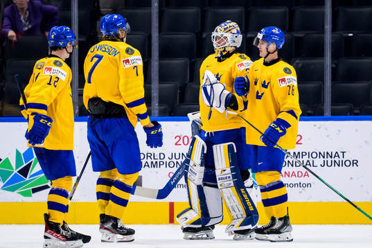 Goaltender Calle Clang of Sweden celebrate with his