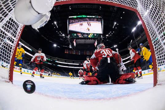 Goaltender Sebastian Wraneschitz of Austria lets in the 0-1