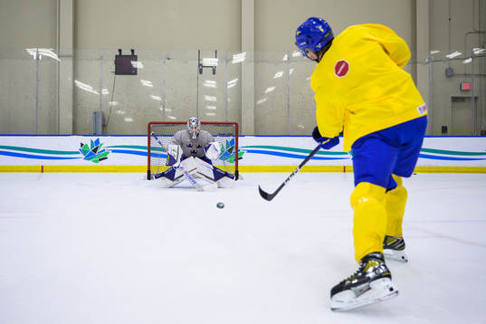 Goaltender Jesper Wallstedt and Måns Forsfjäll of Sweden