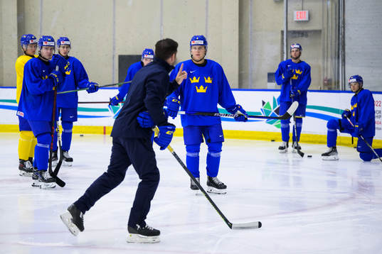 Emil Andrae listens to assistant coach Todd Woodcroft of