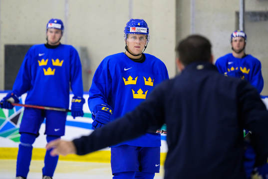 Emil Andrae listens to assistant coach Todd Woodcroft of