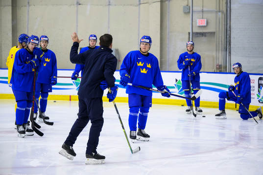 Emil Andrae listens to assistant coach Todd Woodcroft of
