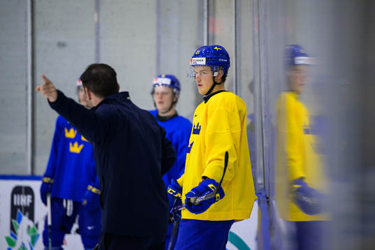 Oskar Olausson listens to assistant coach Todd Woodcroft of