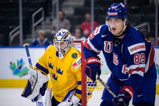 Goaltender Jesper Wallstedt of Sweden and Matt Knies of USA
