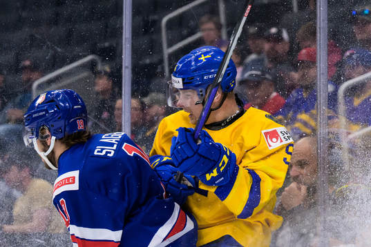 Landon Slaggert of USA tackles Anton Olsson of Sweden