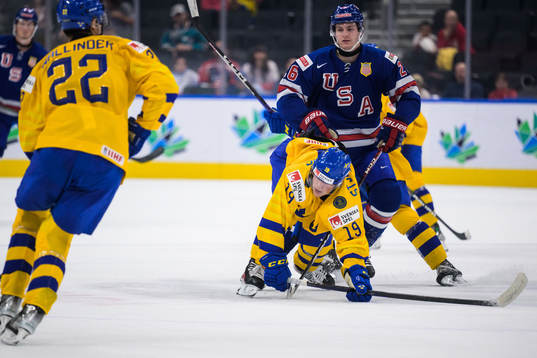 Victor Stjernborg of Sweden gets tackled by Hunter McKown