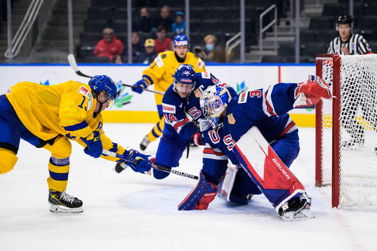 Åke Stakkestad of Sweden scores 3-2 behind goaltender