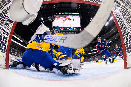 Brett Berard of USA scores 1-0 behind goaltender Jesper