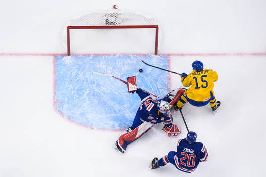 Goaltender Kaidan Mbereko and Red Savage of USA are being