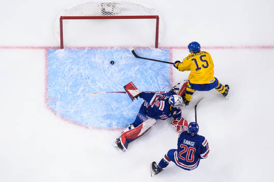 Goaltender Kaidan Mbereko and Red Savage of USA are being
