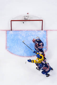 Oskar Magnusson of Sweden celebrates as goaltender Kaidan