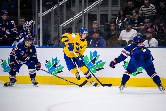 Carter Mazur and Matt Knies of USA are being challenged by