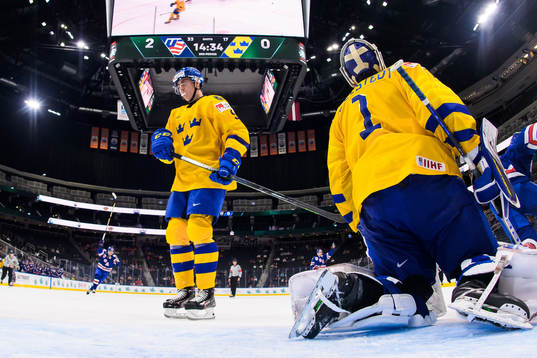 Daniel Ljungman and goaltender Jesper Wallstedt of Sweden
