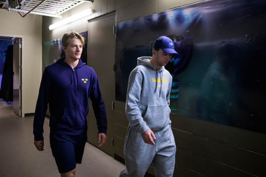 Goaltender Carl Lindbom and Isak Rosén of Sweden arrive to