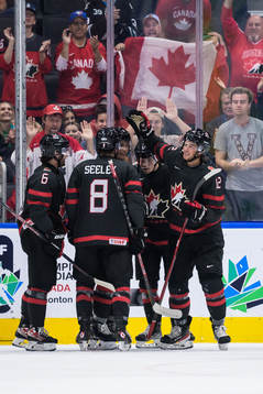 Tyson Foerster of Canada celebrates with teammates
