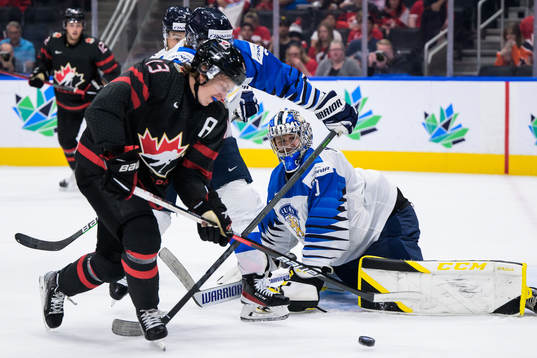 Kent Johnson of Canada in front of goaltender Leevi