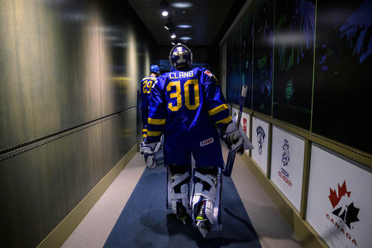 Goaltender Calle Clang of Sweden walks towards the ice for