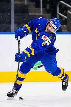 Måns Forsfjäll of Sweden shoots the puck