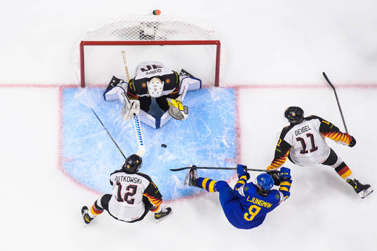 Maciej Rutkowski, goaltender Nikita Quapp and Korbinian