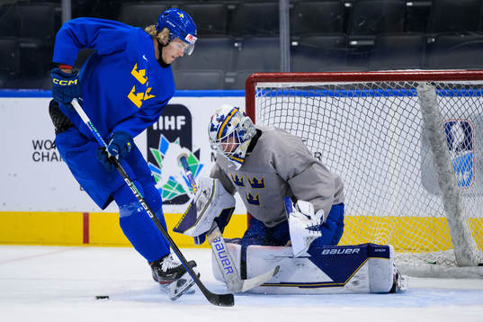 Simon Edvinsson and goaltender Jesper Wallstedt of Sweden