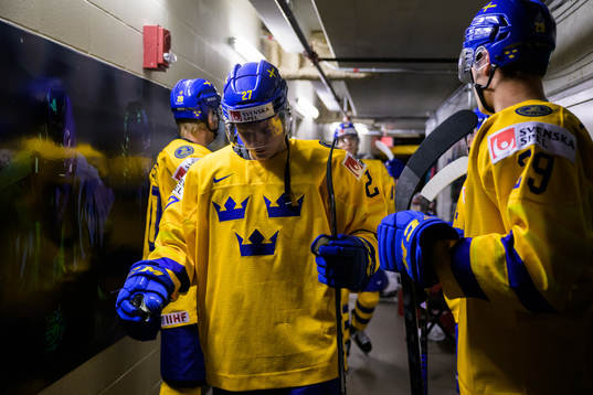 Theodor Niederbach of Sweden waiting to walk out to the ice