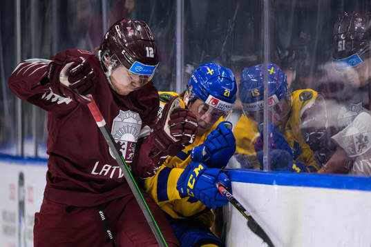 Harijs Brants of Latvia tackles Oskar Olausson of Sweden