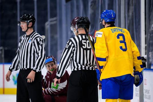Martins Lavins of Latvia smiles at Helge Grans of Sweden