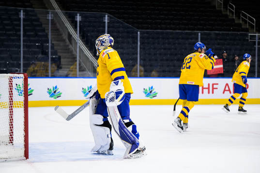Goaltender Jesper Wallstedt of Sweden looks dejected