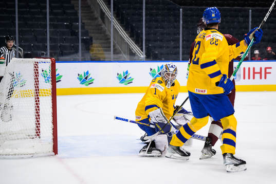 Goaltender Jesper Wallstedt of Sweden lets in the 1-1 goal