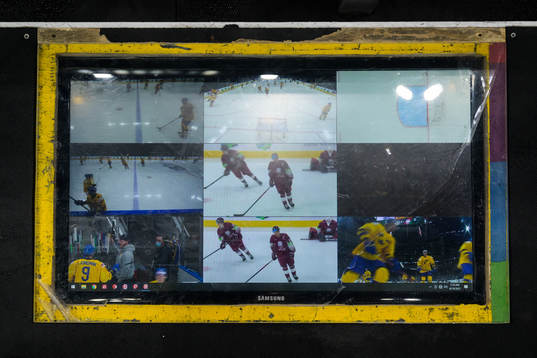 A tv screen at coaches position showing broadcast video
