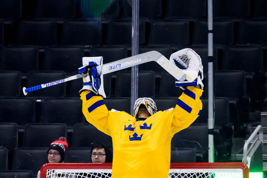 Goaltender Jesper Wallstedt of Sweden  celebrates