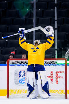 Goaltender Jesper Wallstedt of Sweden  celebrates