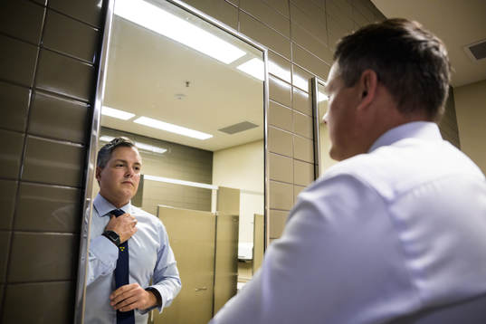 Head coach Tomas Montén of Sweden adjusts his tie
