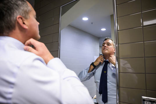 Head coach Tomas Montén of Sweden adjusts his tie