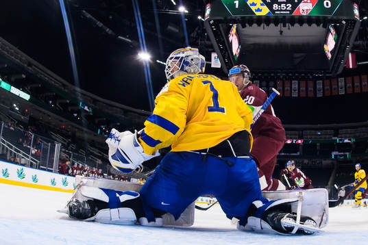 Goaltender Jesper Wallstedt of Sweden and Peteris Purmalis