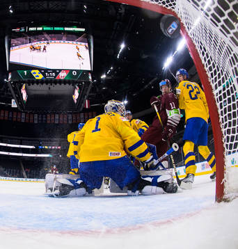Goaltender Jesper Wallstedt of Sweden lets in the 1-1 goal