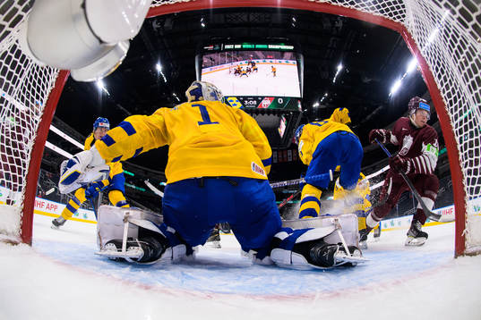 Emil Andrae, goaltender Jesper Wallstedt and Leo Lööf of