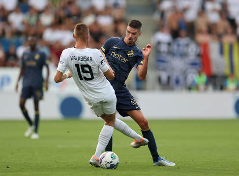 Mikael Lustig of AIK and Jan Kalabiska of Slovacko