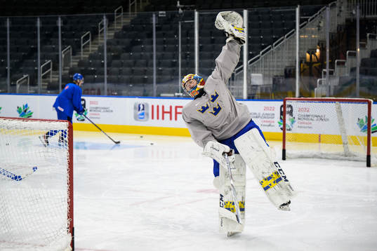 Goaltender Carl Lindbom of Sweden celebrates at a practice
